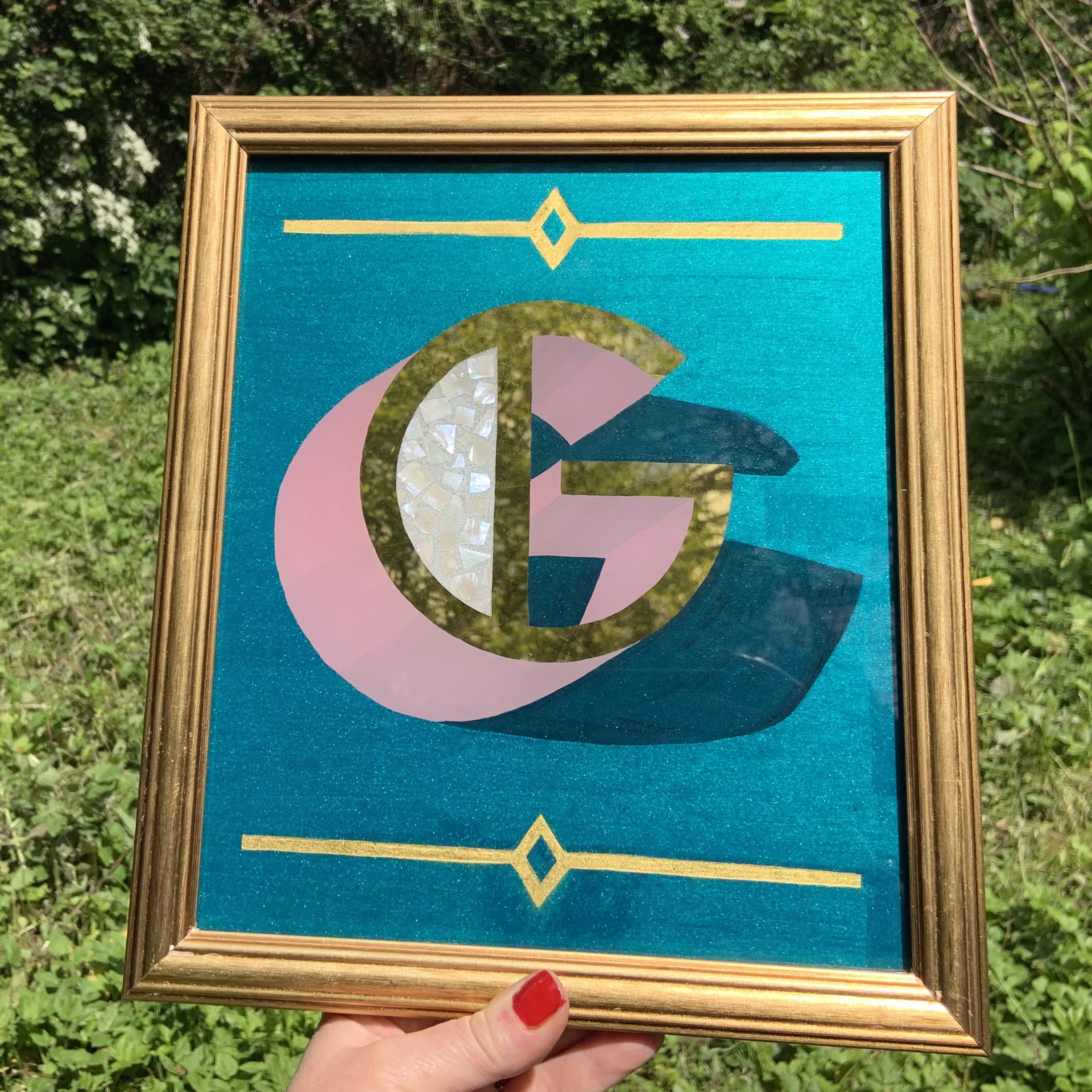 Reverse glass gilded letter with mother of pearl inlay