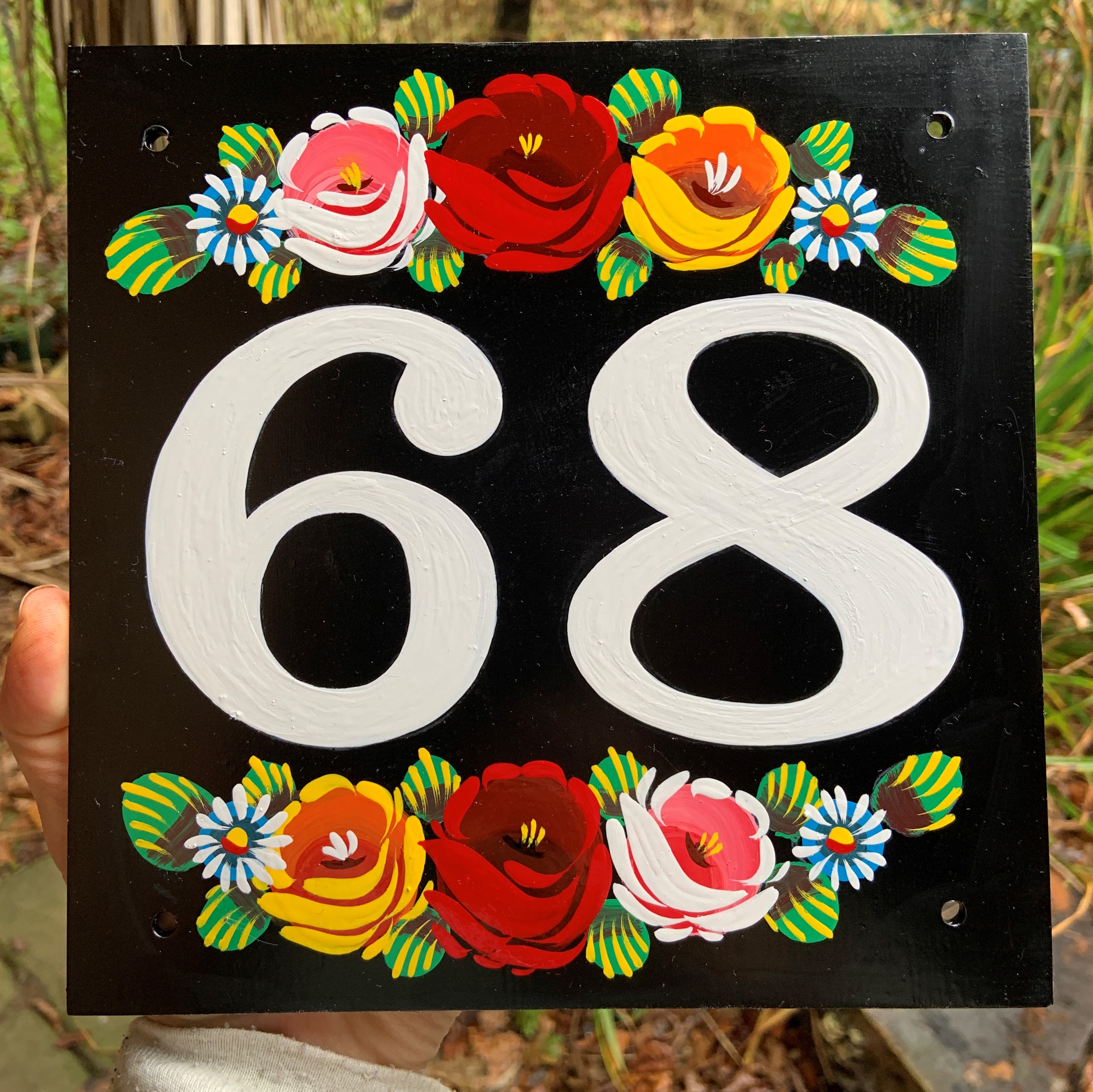 Canal roses house number sign