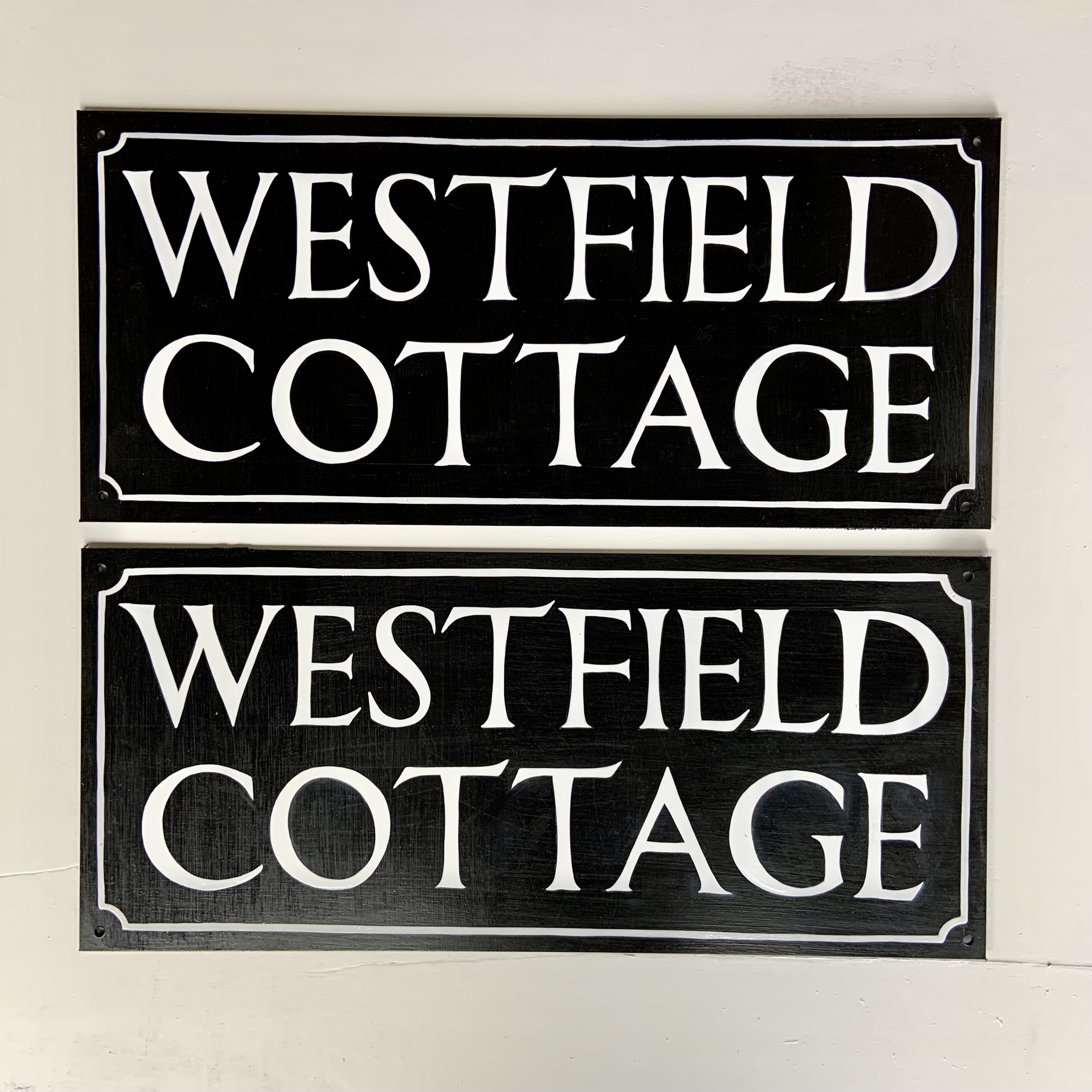 Classic Roman hand lettered and painted house sign