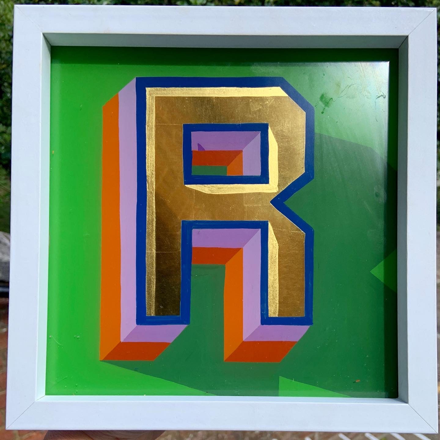 Reverse glass gold leaf letter R