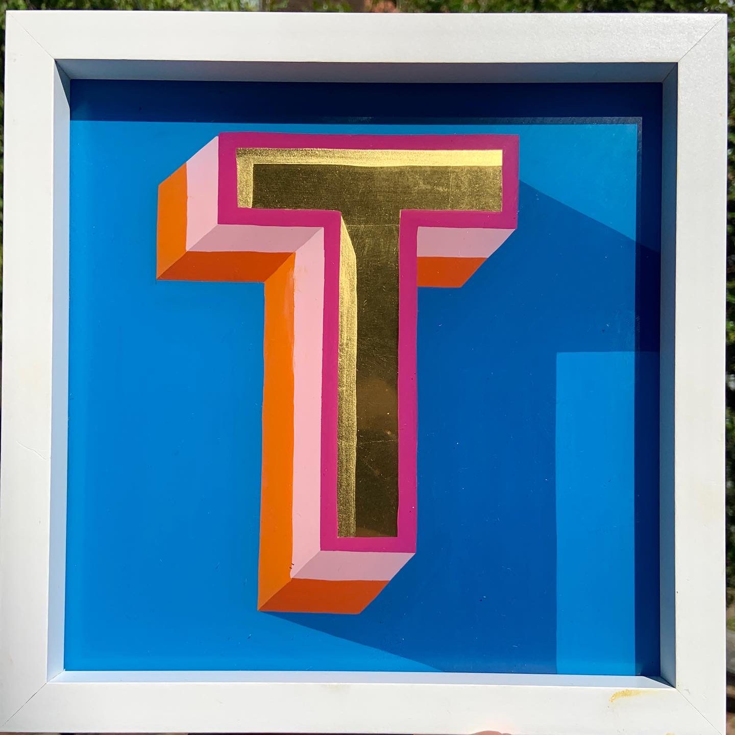 Reverse glass gold leaf letter T