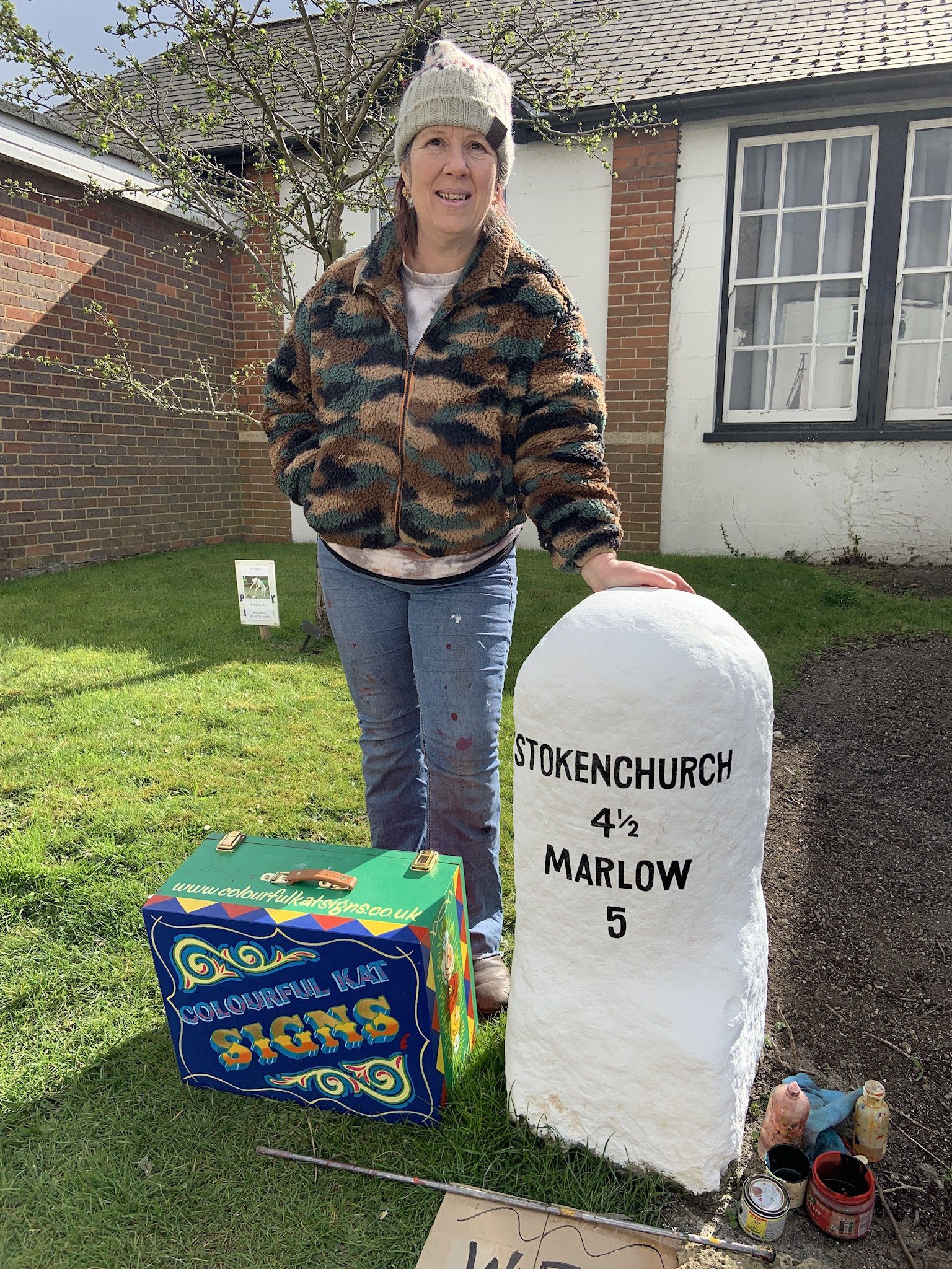 Me standing next to the freshly painted Milestone by Lane End village hall