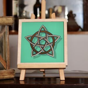 Stunning gold leaf mirror effect 5 pointed celtic knot star in 2 colours of genuine gold leaf on a green background and framed in oak wood