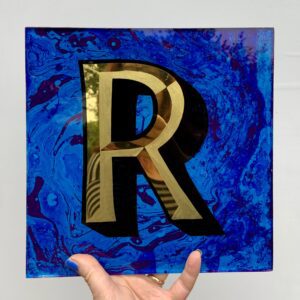 Reverse Glass gilded letter R in 23carat yellow gold and blue marbled background, unframed