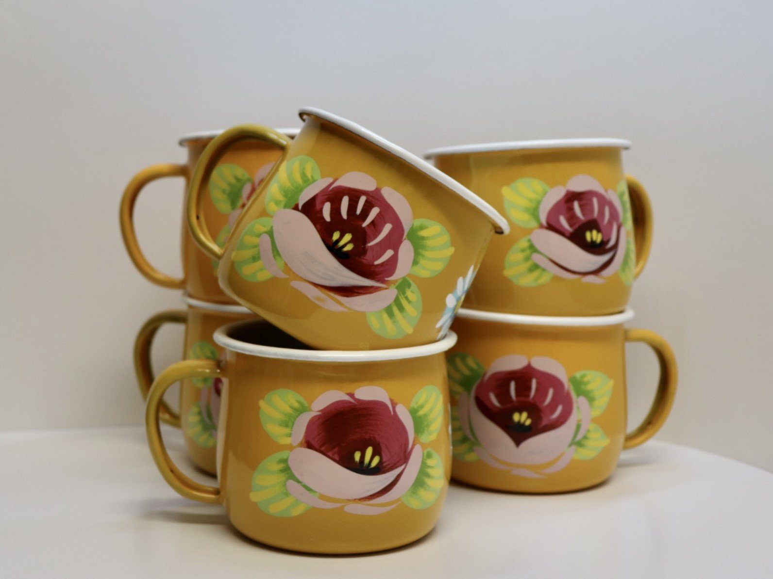 Canal Roses handpainted yellow enamel mugs with pink roses & daisies