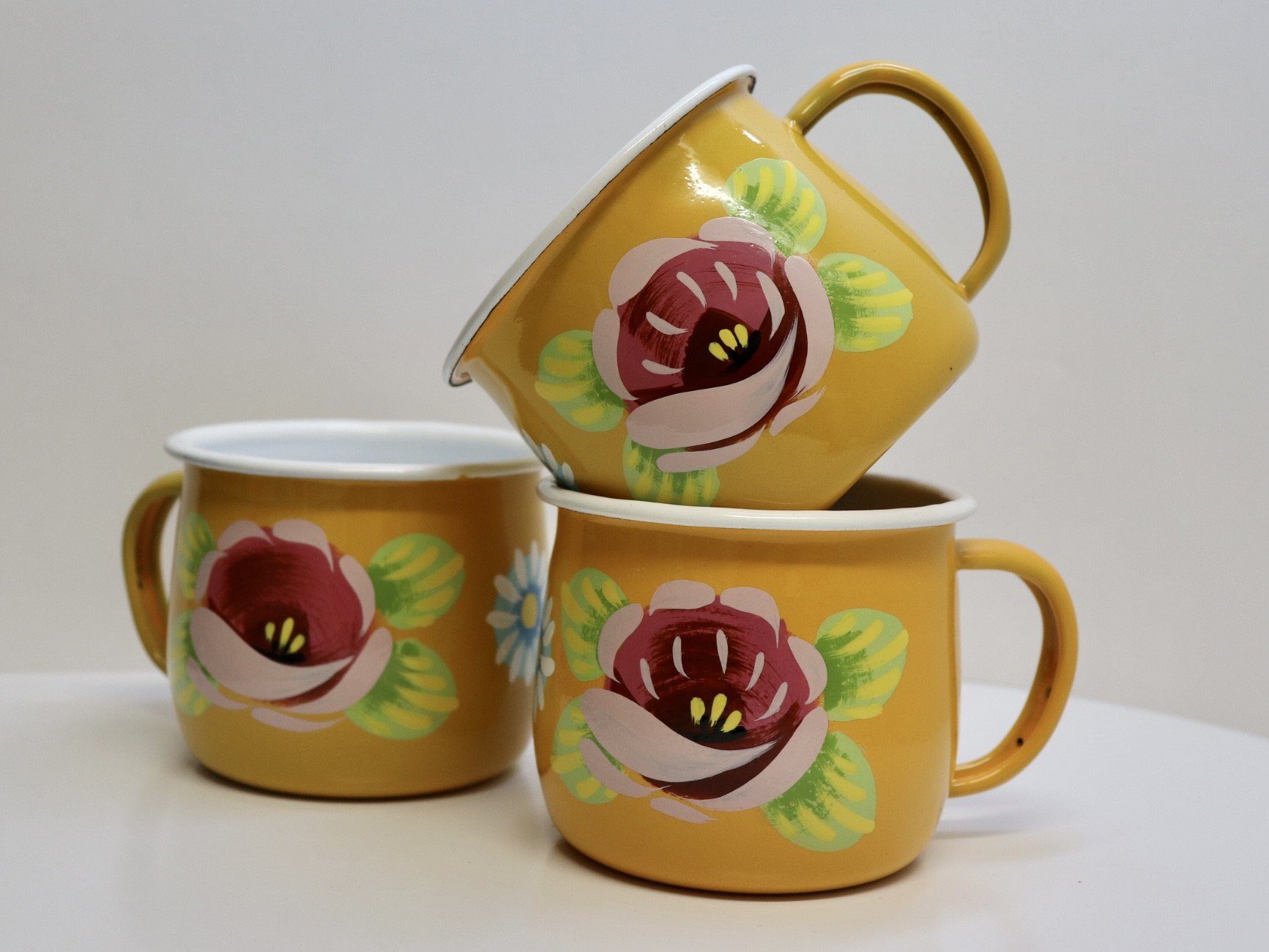 Canal Roses handpainted yellow enamel mugs with pink roses & daisies