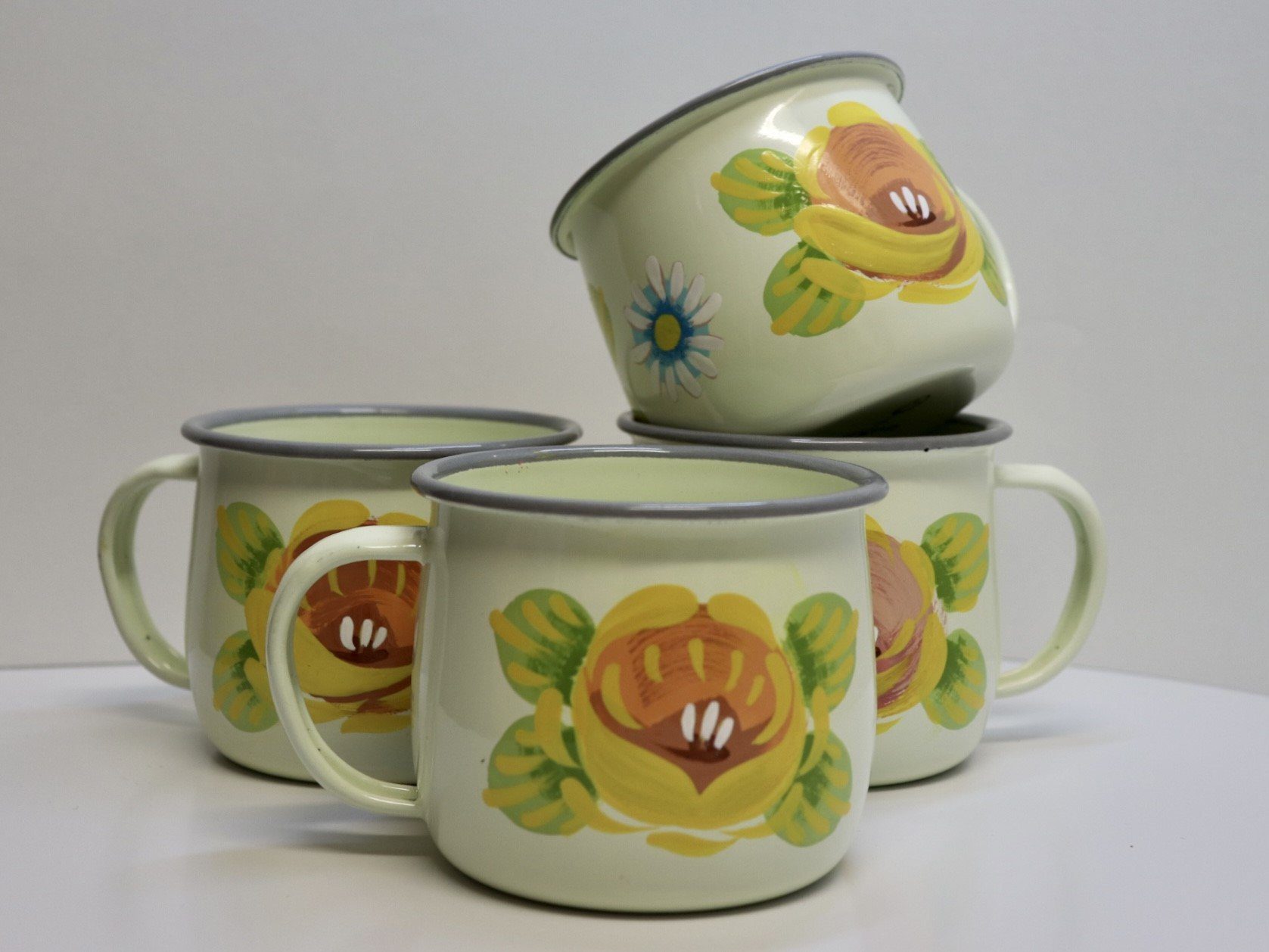 Canal Roses handpainted cream enamel mugs with yellow roses & daisies