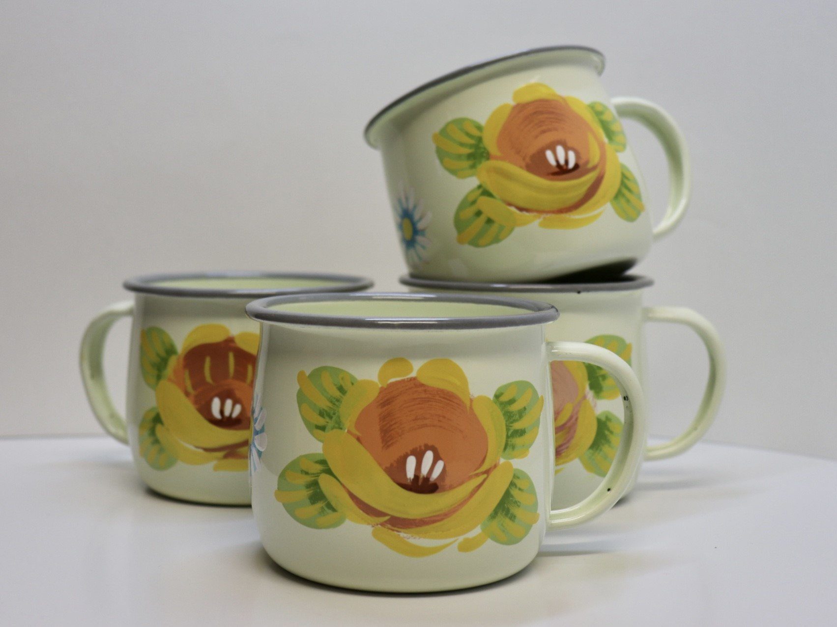 Canal Roses handpainted cream enamel mugs with yellow roses & daisies