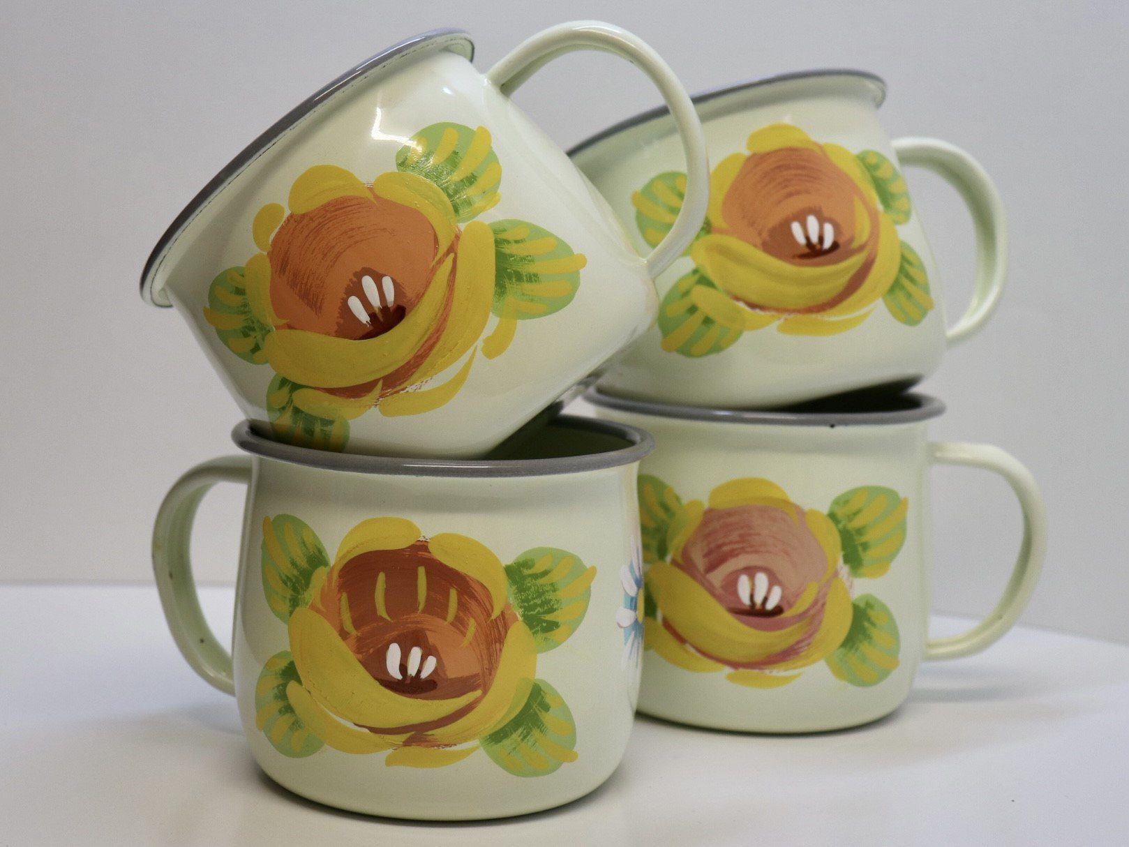 Canal Roses handpainted cream enamel mugs with yellow roses & daisies