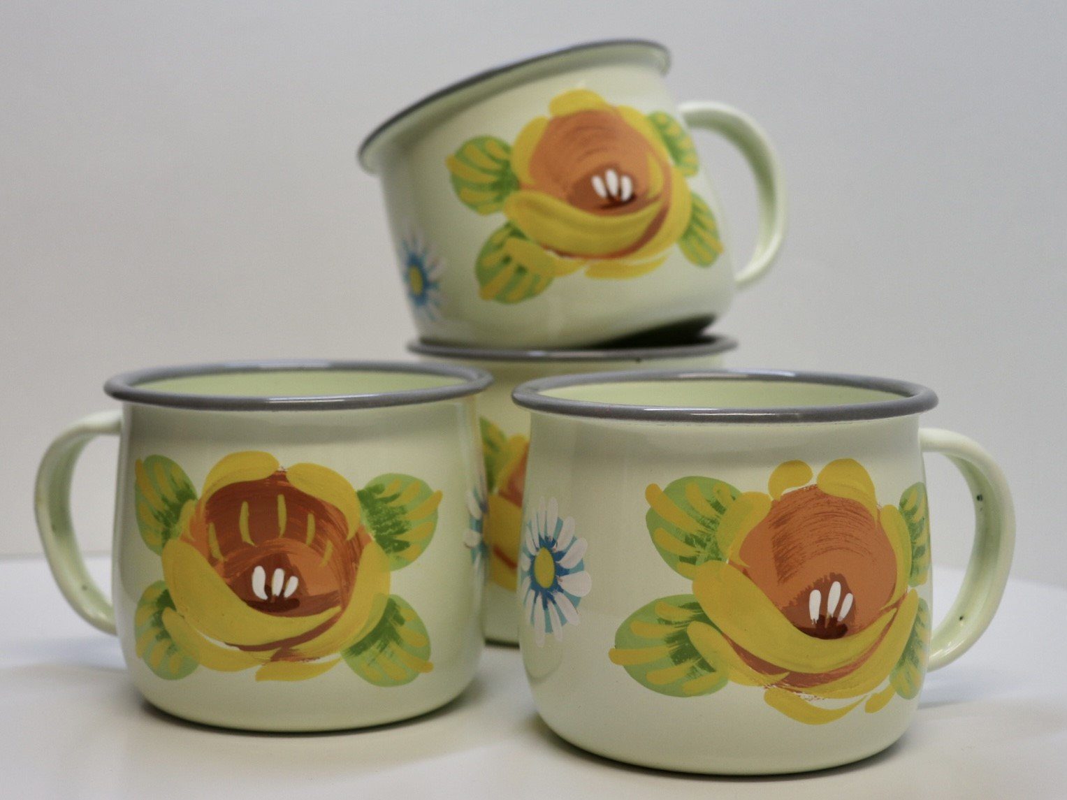 Canal Roses handpainted cream enamel mugs with yellow roses & daisies