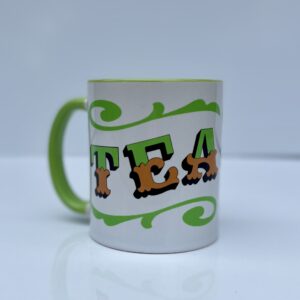 White & green ceramic mug with Circus Style hand-lettered ‘TEA’ design side view