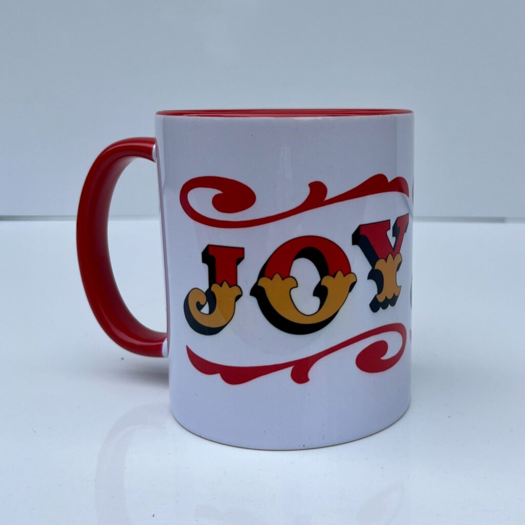 White & red ceramic mug with Circus Style hand-lettered ‘JOY’ design