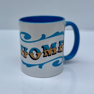 White & blue ceramic mug with Circus Style hand-lettered ‘HOME’ design