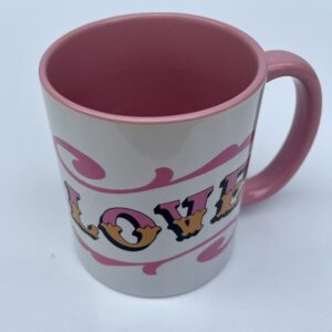 White & pink ceramic mug with Circus Style hand-lettered ‘LOVE’ design