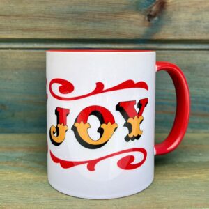 White ceramic 11oz mug with circus style JOY lettering design wrap around and colourful red rim, handle and inside, side view