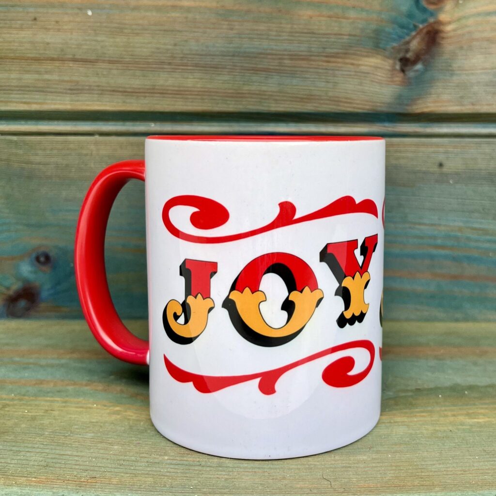 White & red ceramic mug with Circus Style hand-lettered ‘JOY’ design