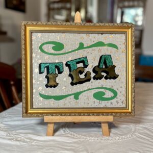 ‘TEA’ Glass Gold leaf Circus Style Lettering Artwork with Glitter and Decorative Scrolls