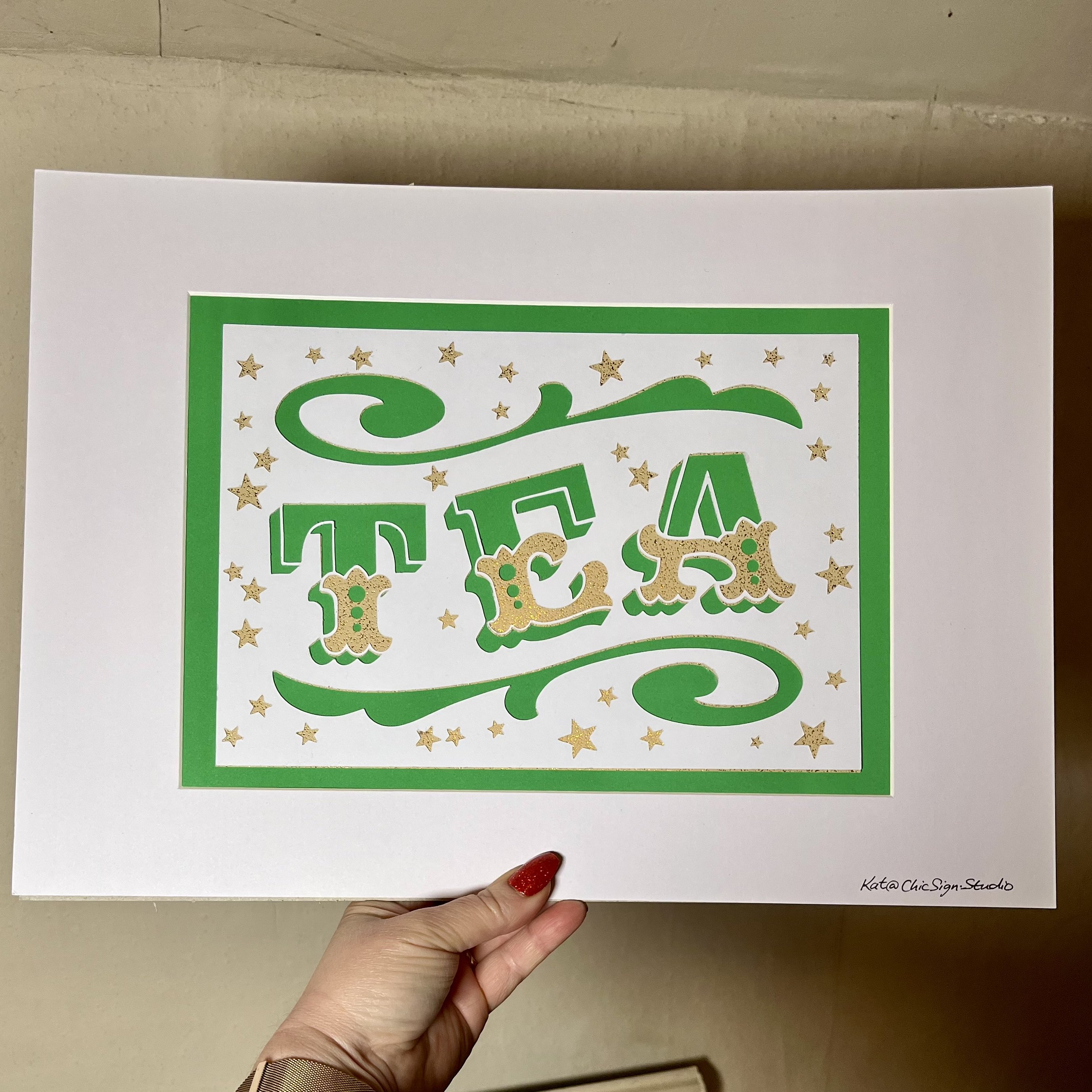 TEA handfinished papercut lettering artwork with window mount and backing board in green, white & gold card