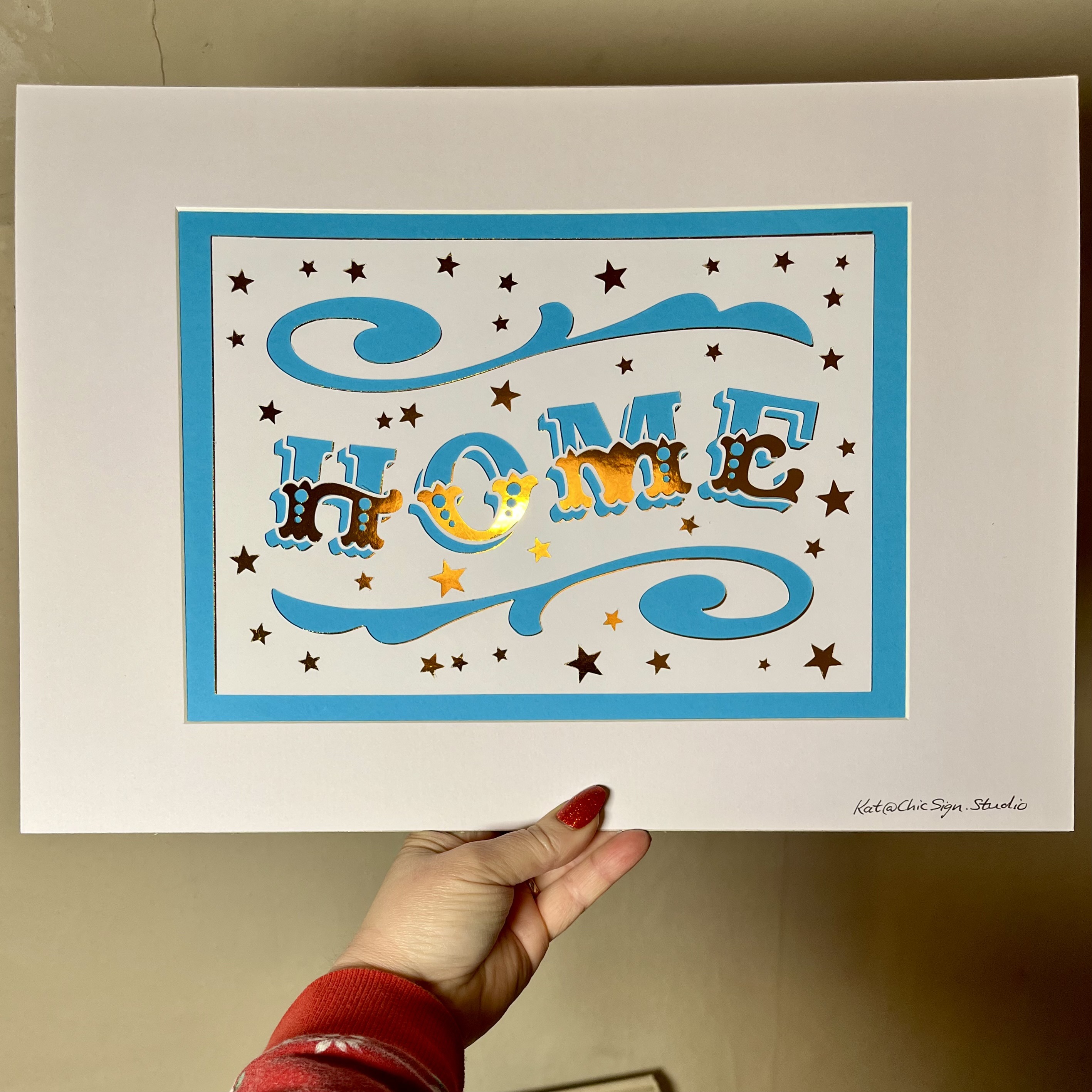 HOME handfinished papercut lettering artwork with window mount and backing board in blue, white & gold card