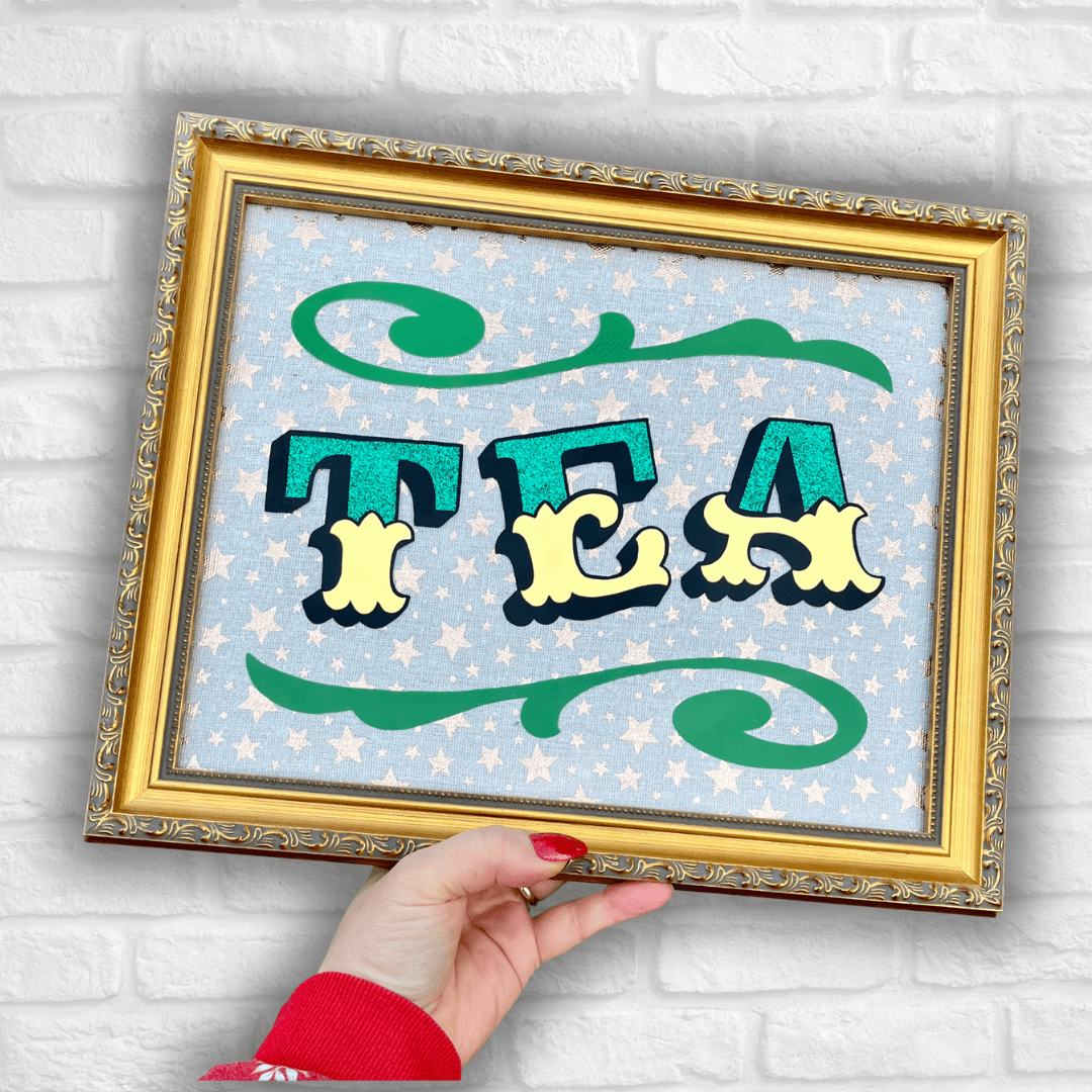 ‘TEA’ Glass Gold leaf Circus Style Lettering Artwork with Glitter and Decorative Scrolls