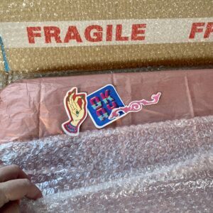 Packaged artwork with stickers