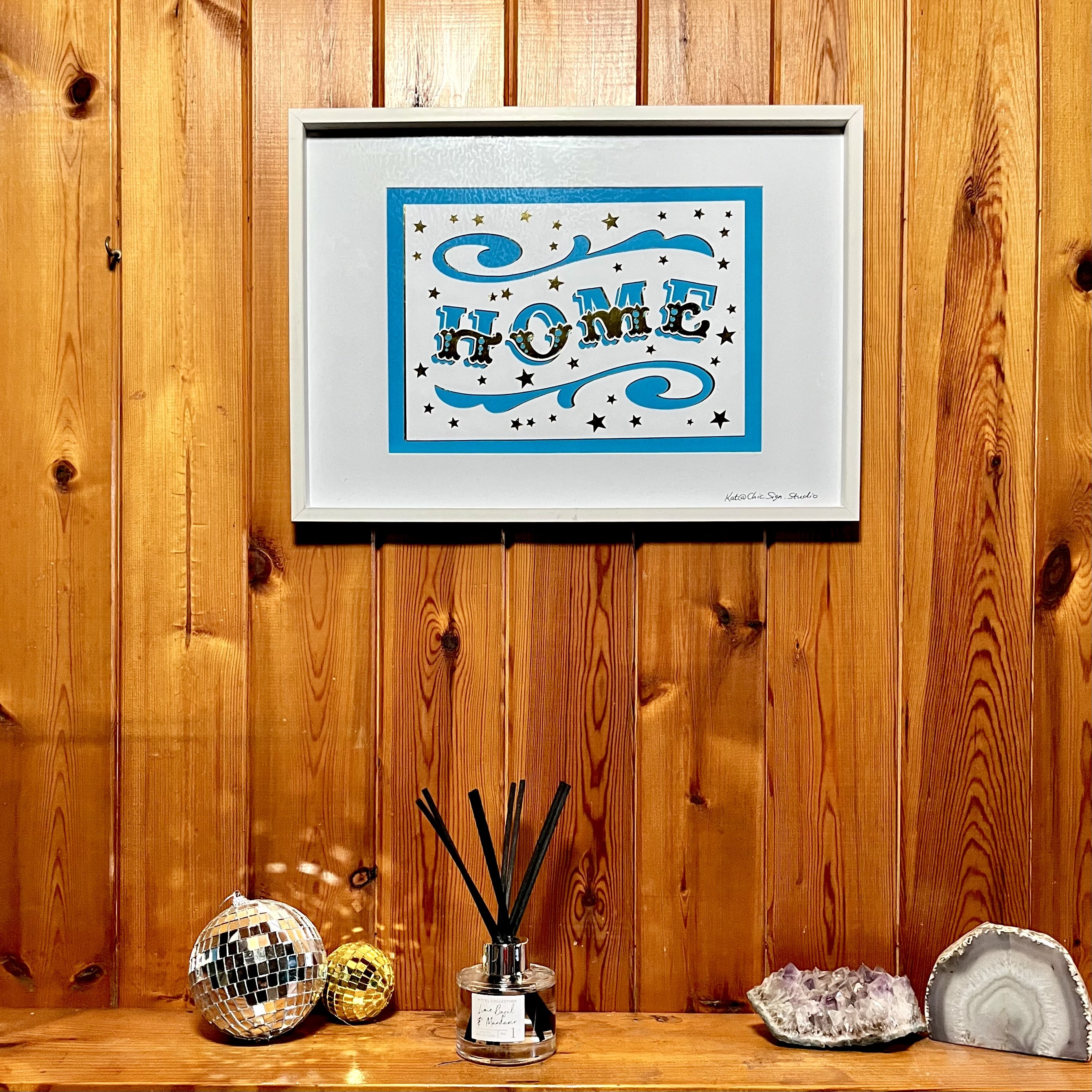 HOME papercut lettering art A3 poster in a white frame