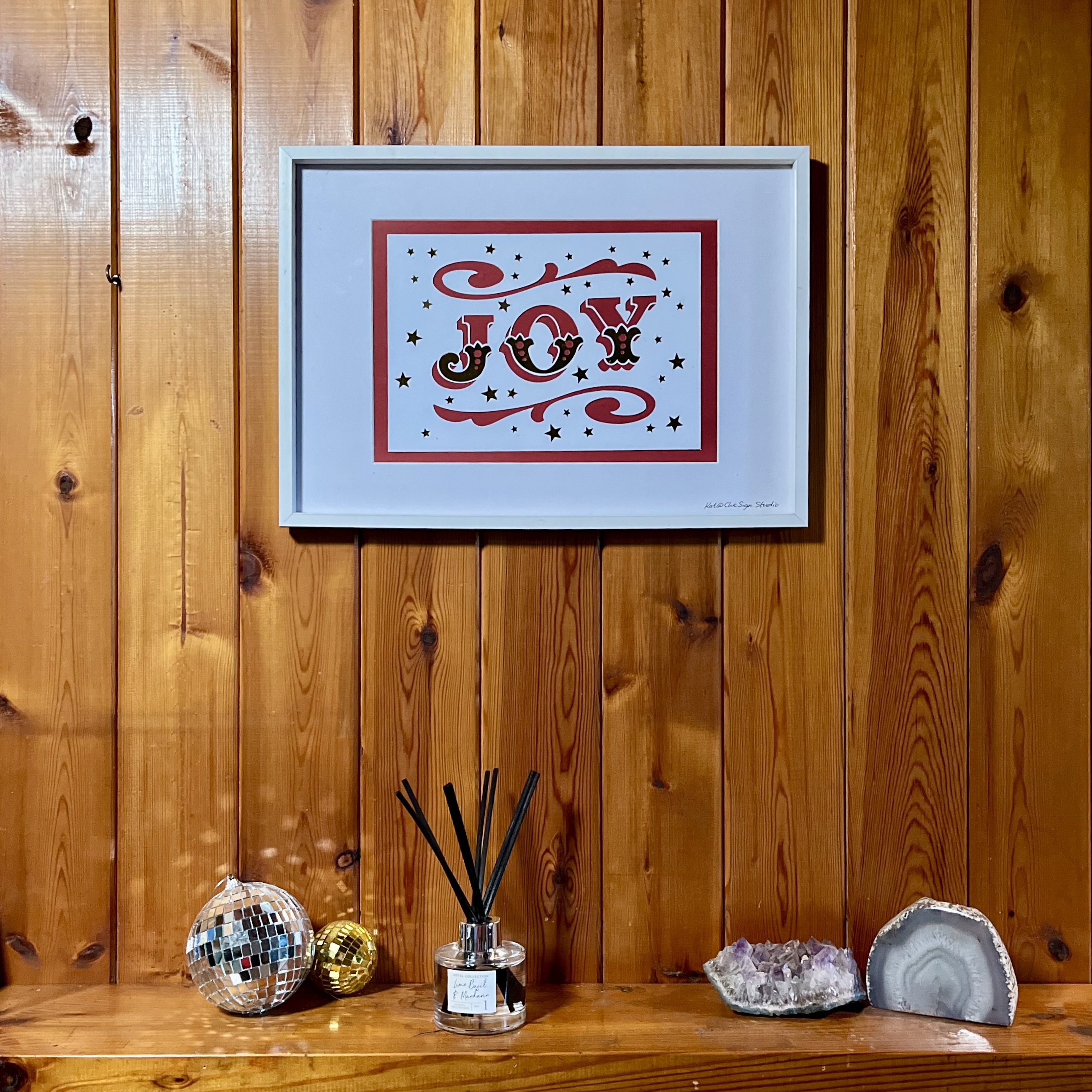 JOY papercut lettering art A3 poster in a white frame