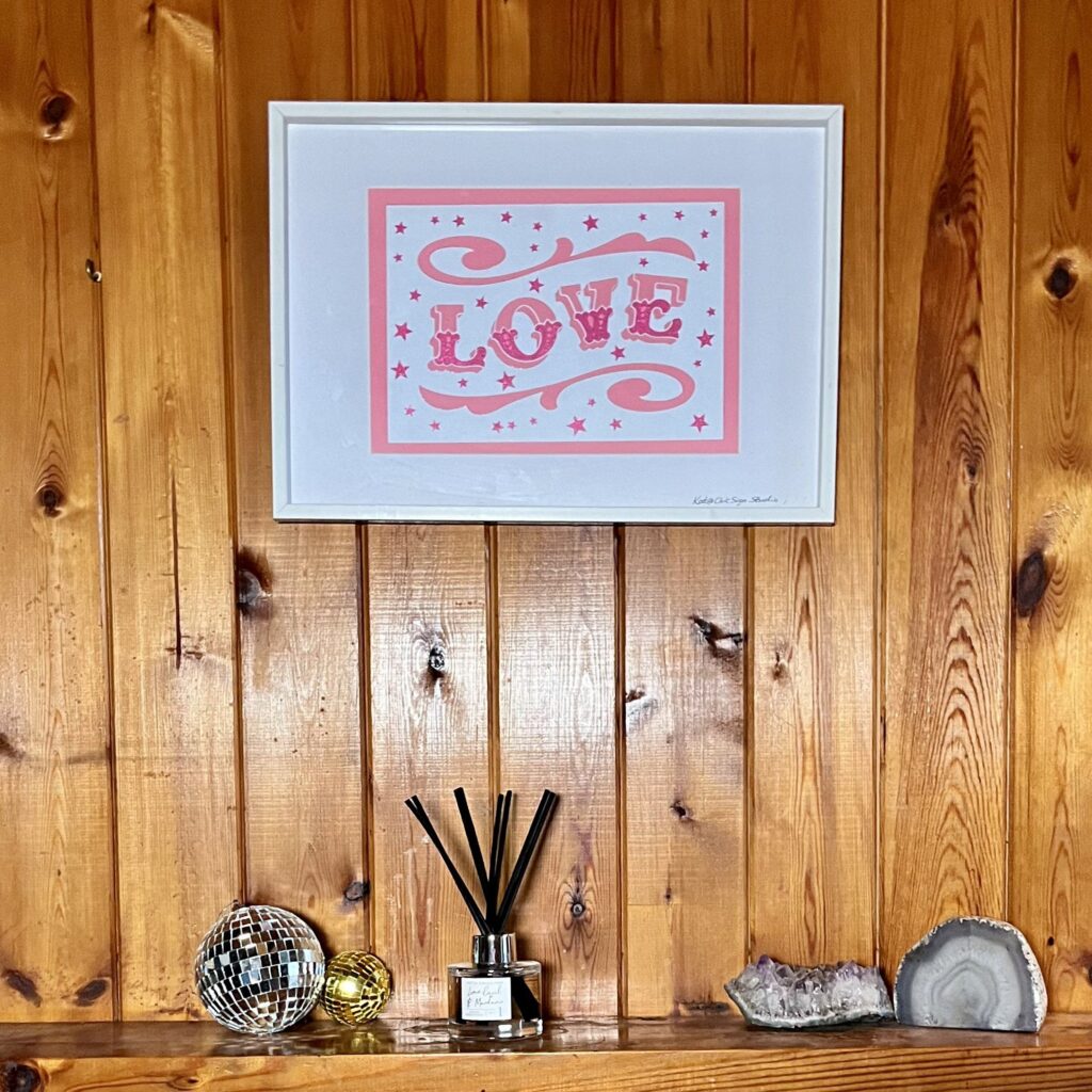 LOVE papercut lettering art A3 poster in a white frame